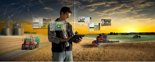man in a field with machinery, and network lines to connect his big data